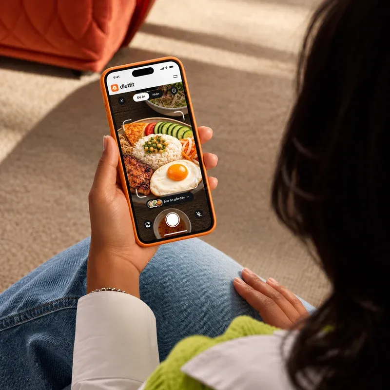 A person holding a phone showing a food post made with LayerProof